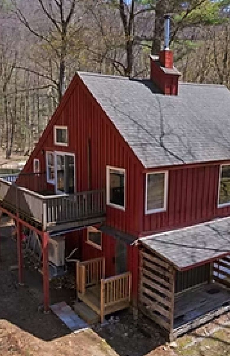 Side of the chalet with the upper deck