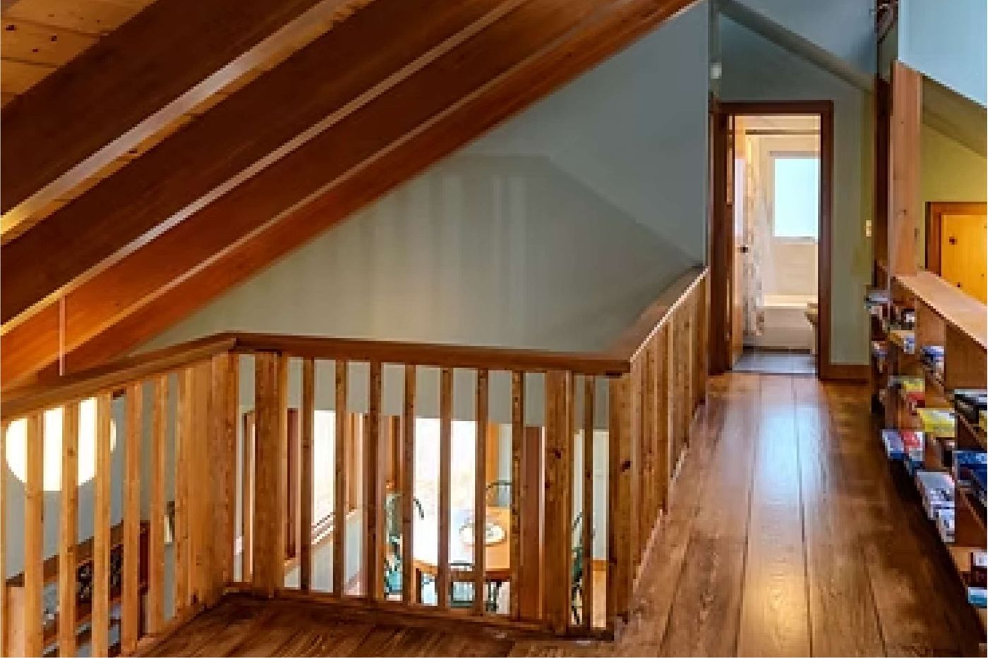 Upstairs loft hallway with wood railings