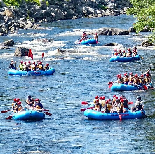 Rafts full of paddlers on the Deerfield River rapids